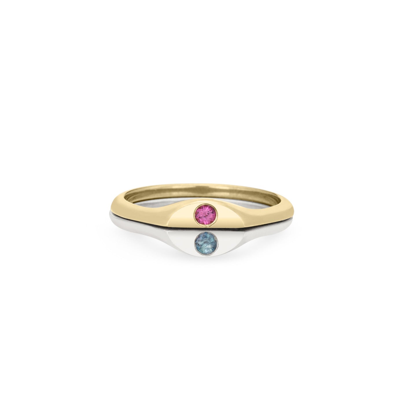 Half solid 14k gold and half sterling silver ring with two flush-set birthstones on a white background