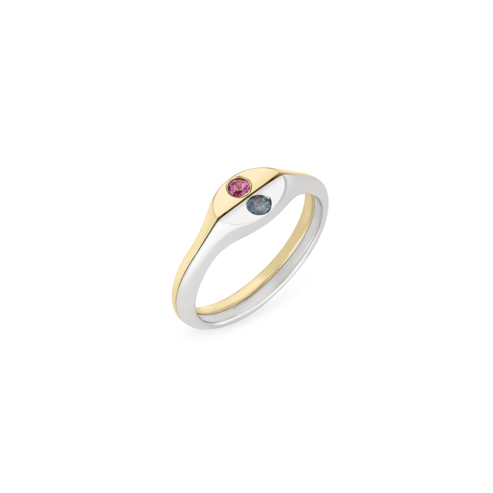 Half solid 14k gold and half sterling silver ring with two flush-set birthstones angled on a white background