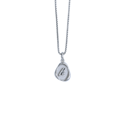 Solid 14k gold charm necklace with custom initial on white background